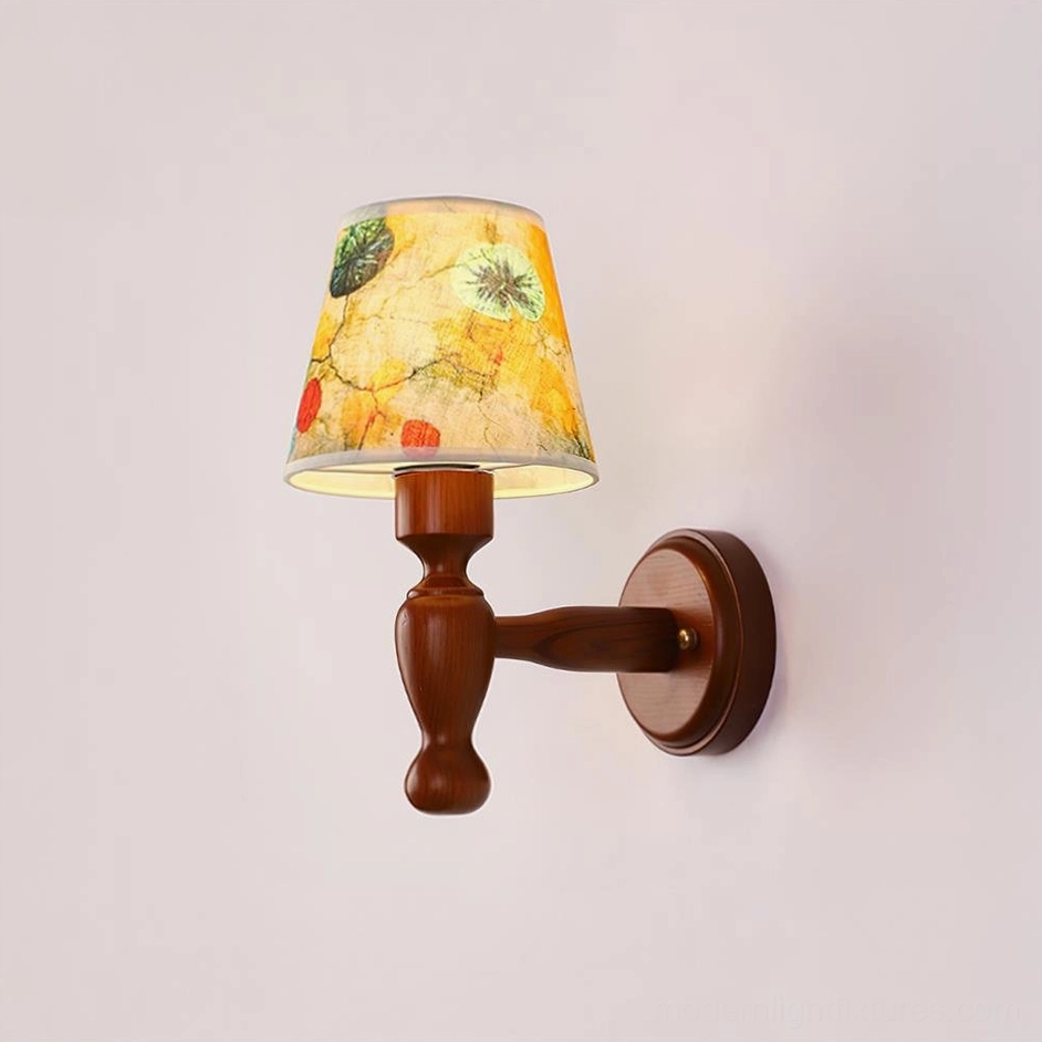 Hand-carved wooden sconce with patterned shade, artisan craftsmanship