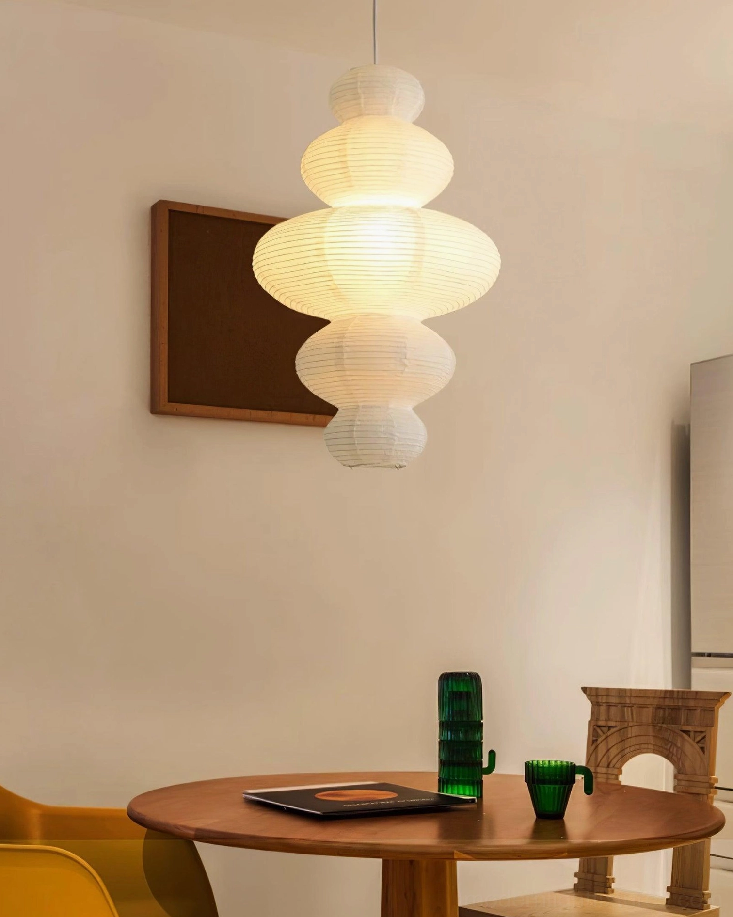 Hand-crafted pendant lamp demonstrating unique artisanal quality of individual rice paper construction