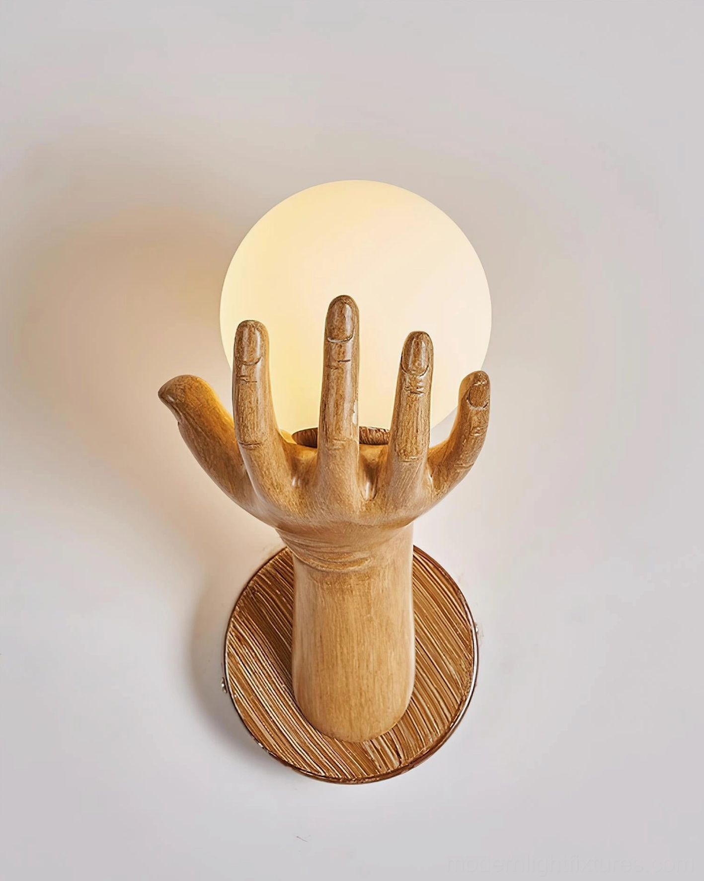 Hand of Victory wall sconce architectural installation in contemporary home interior