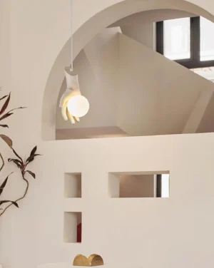 Hand of Victory pendant lamp suspended in Nordic minimalist interior with arched doorway and warm ambient lighting