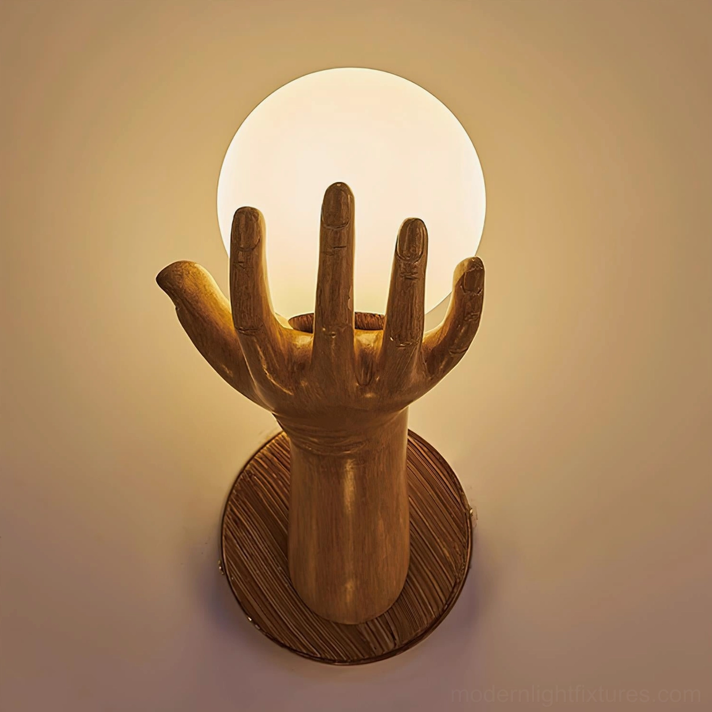 Hand of Victory sculptural wall sconce showing metal and polymer material combination