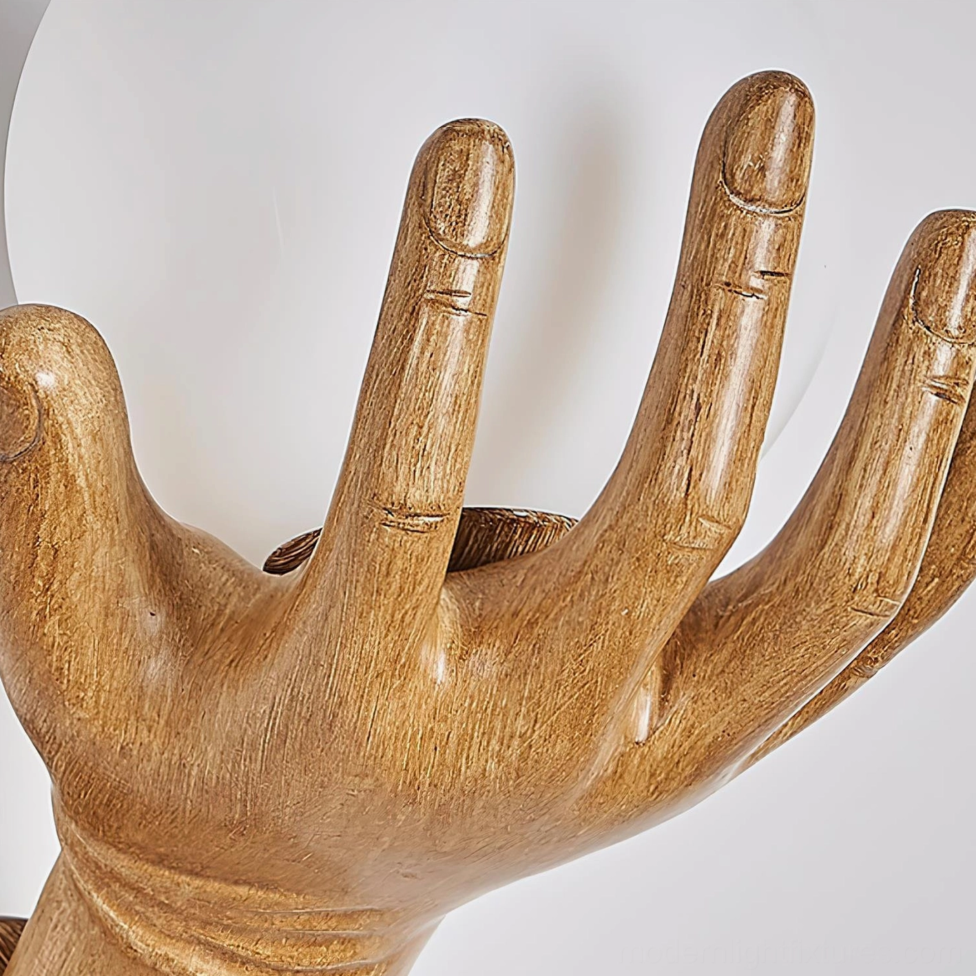 Hand of Victory sculptural wall lamp showing design versatility in modern interior design