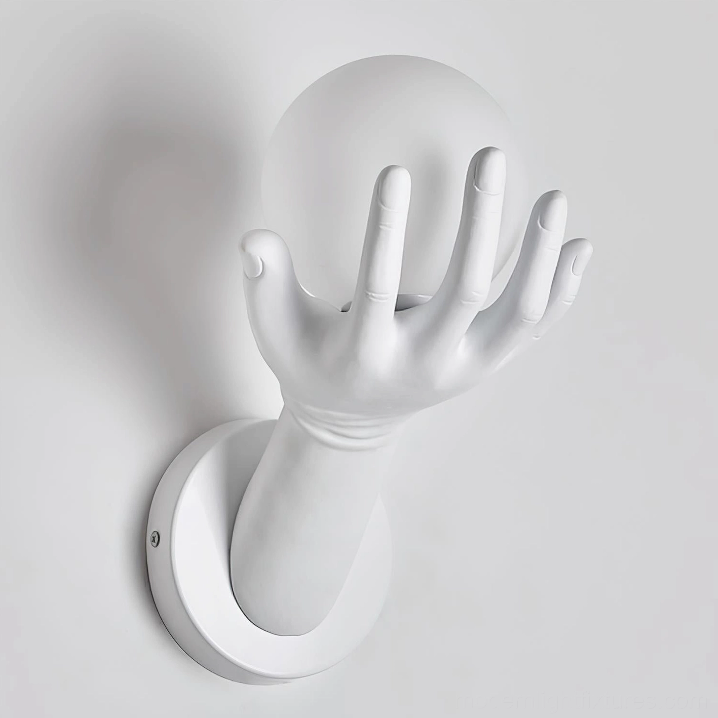 Hand of Victory wall sconce corner view highlighting three-dimensional sculptural form