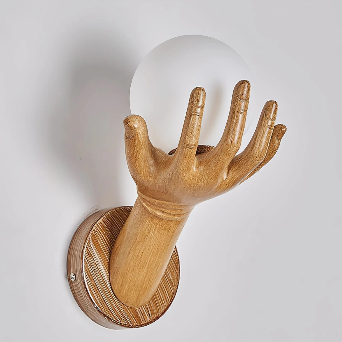 Hand of Victory sculptural lamp mounted installation showing wall mounting hardware and position