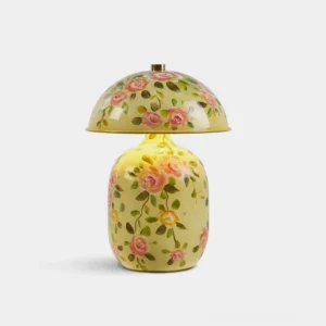 Hand-painted ceramic mushroom table lamp with pale yellow floral design, front view with studio lighting