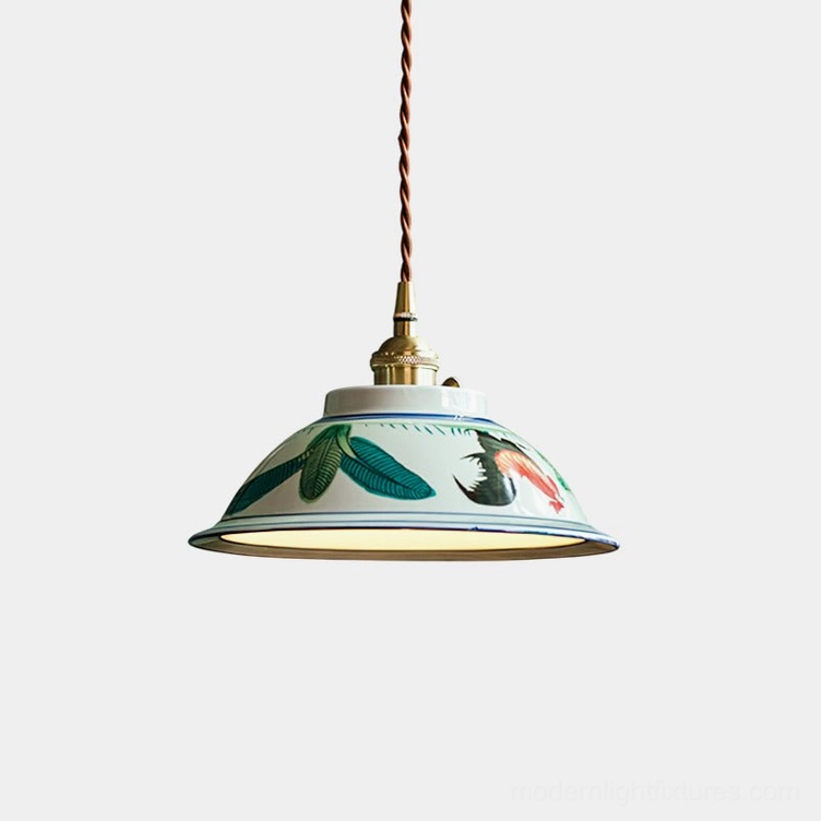 Hand-painted ceramic pendant light with delicate floral motifs, brass hardware, and braided cord—studio close-up view showcasing artisanal details