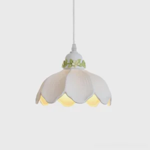 Hand-painted ceramic petal pendant light with white gloss finish and green botanical floral motifs, front studio view