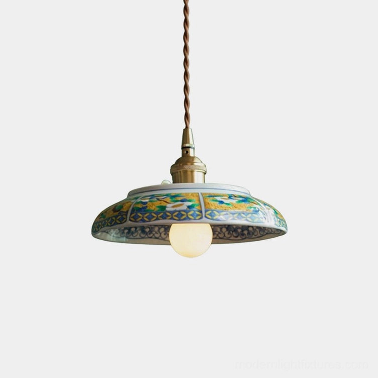 Hand-painted ceramic saucer pendant light with brass E27 socket and twisted brown fabric cord, front studio view