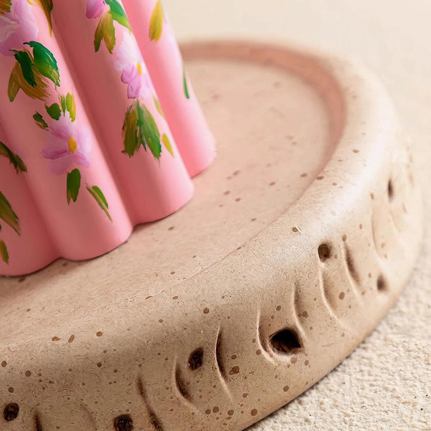 Close-up detail of hand-painted floral pattern on ceramic lamp base showing artistic brush strokes and matte finish texture