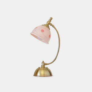 Vintage floral table lamp with hand-painted ceramic shade and brass gold metal base, front view on white background