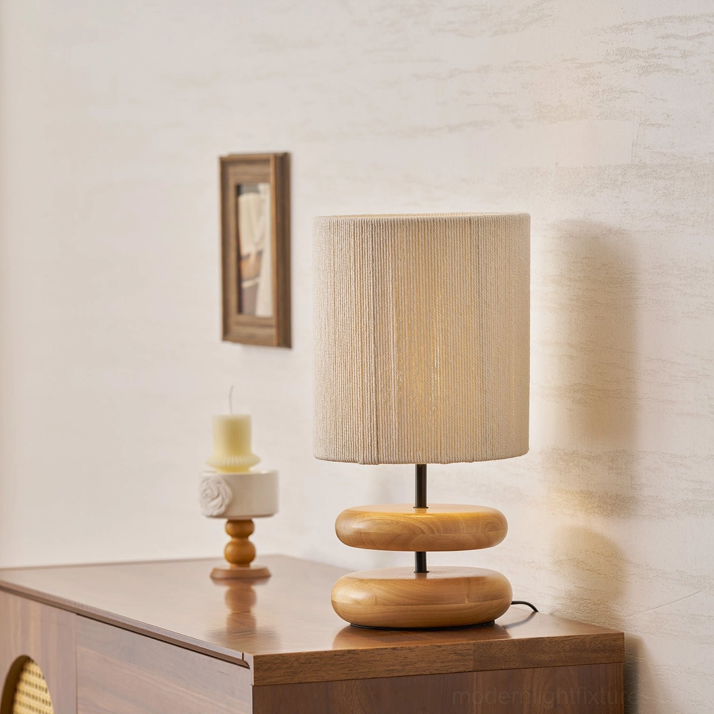 Hand-turned walnut wood lamp base with beige fabric shade detail view