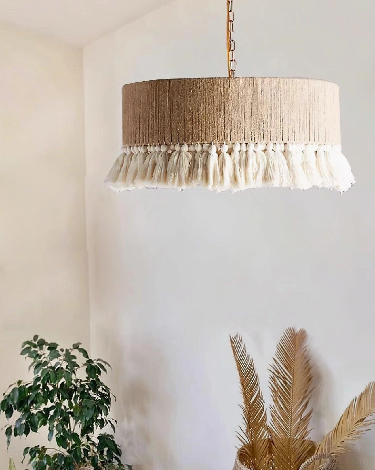 Hand-woven bohemian pendant lamp showing artistic tassel detail and light diffusion