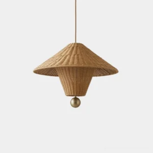 Hand-woven natural rattan pendant light with conical-hat silhouette and brass-tone ball finial, front studio view showing detailed rattan weave texture