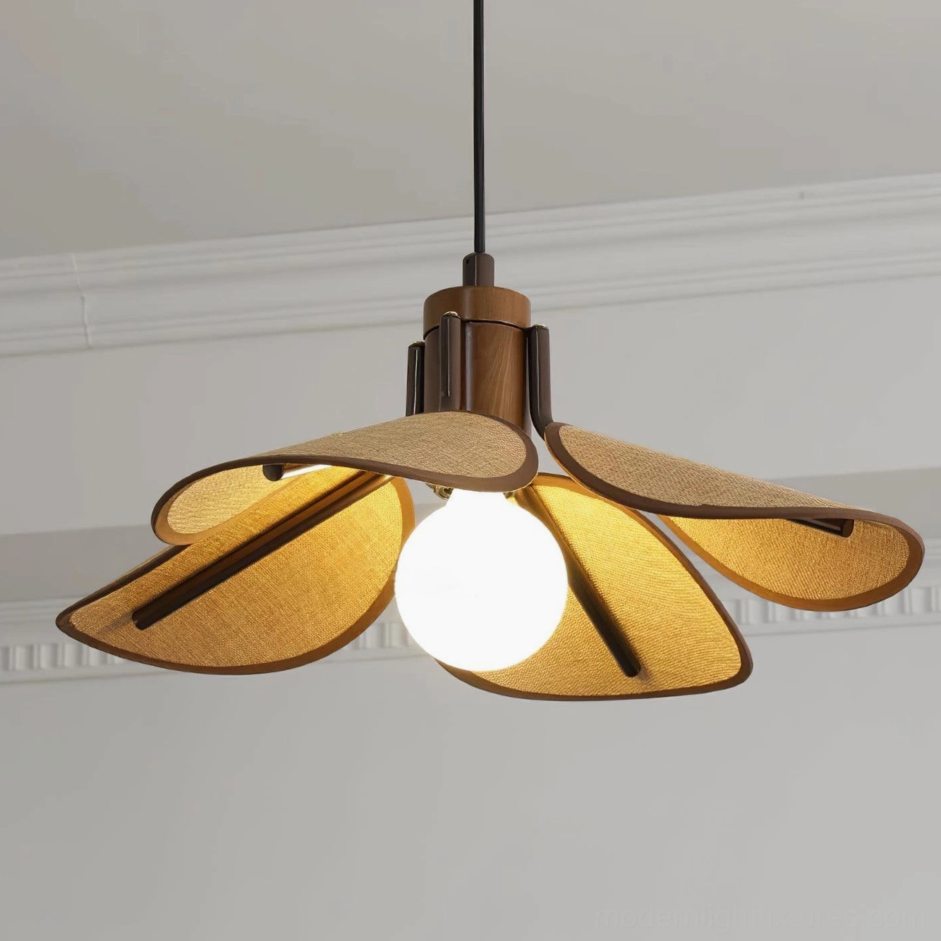 Hand-woven rattan pendant shade with warm honeyed tones and intricate weave pattern detail