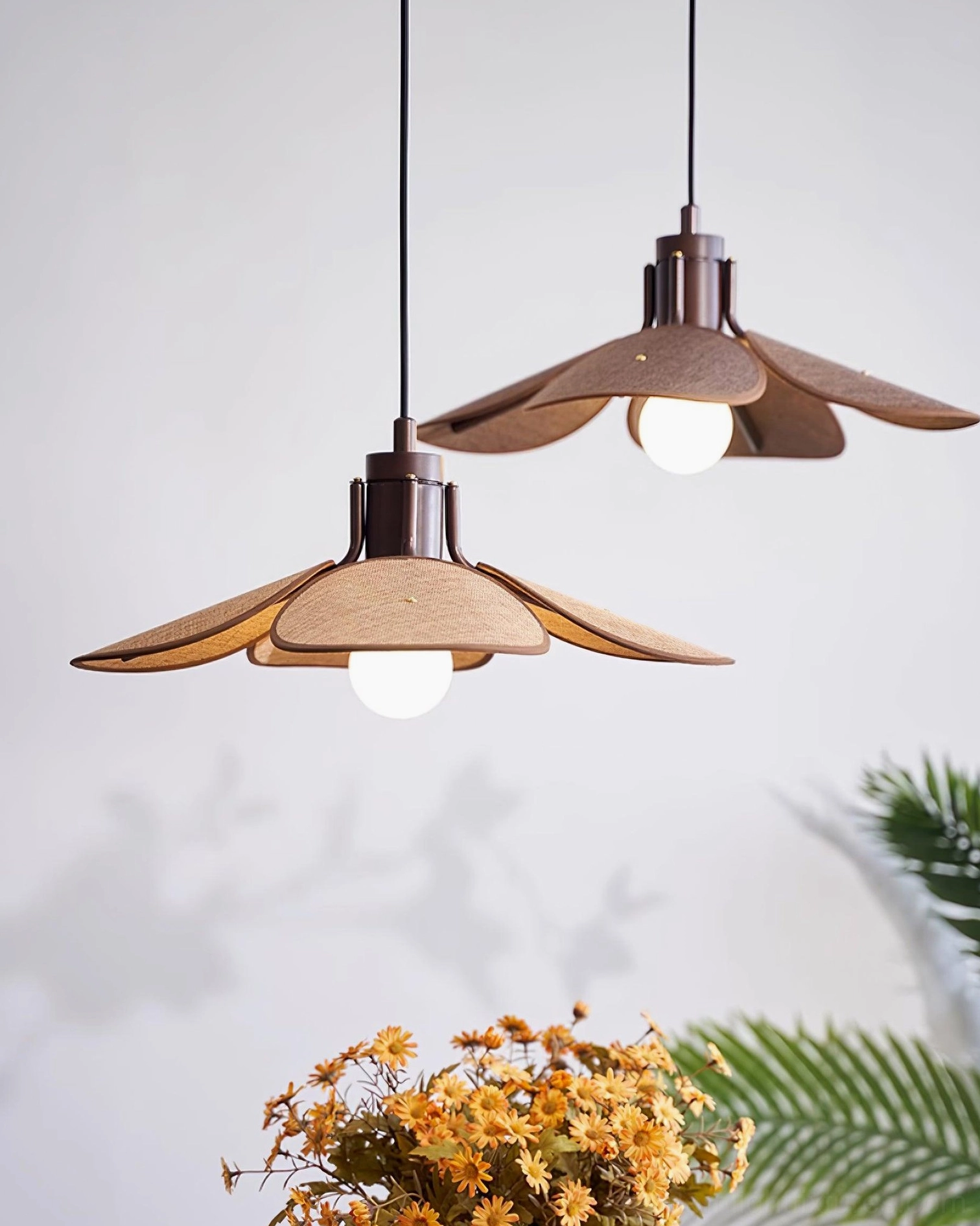 Hand-woven rattan pendant shade detail showing intricate weave pattern and organic texture