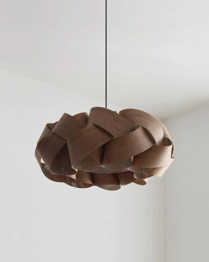 Hand-woven walnut pendant light with matte black ceiling canopy and adjustable fabric-wrapped cord