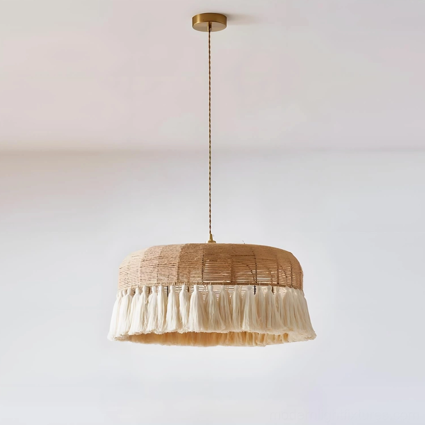 Handcrafted bohemian rattan pendant light in light brown and beige tones, showcasing hemp rope construction and flowing tassel trim