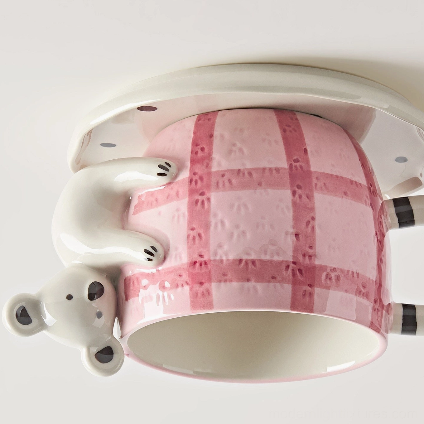 Handcrafted ceramic mug light fixture with glaze detail and color palette