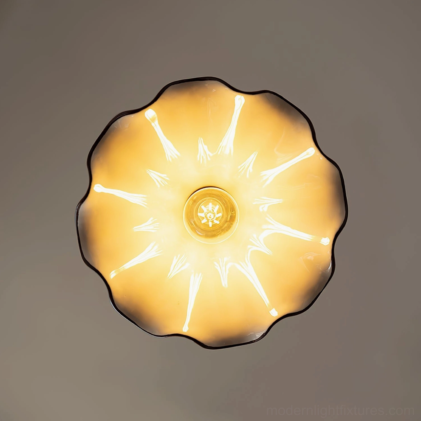 Handcrafted ceramic pendant light with brass accents and twisted cord, European countryside design inspiration