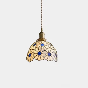 Handcrafted floral stained glass pendant light with daisy pattern and brass fixture, front view studio shot