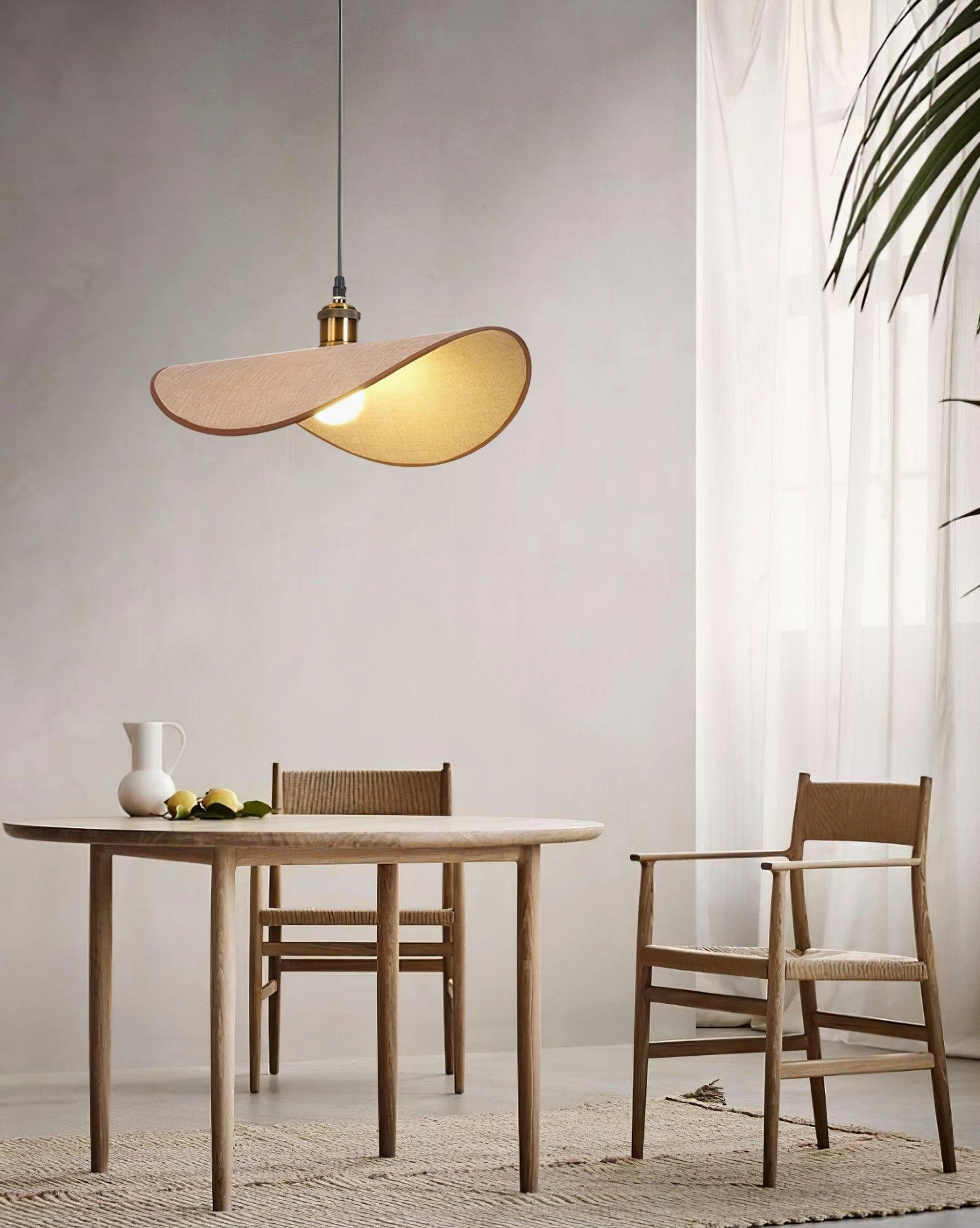 Artisan-crafted wabi-sabi pendant lamp showing fabric shade construction and brass fixture assembly
