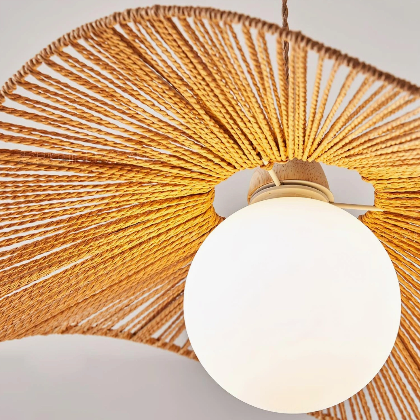Handcrafted woven rattan pendant light close-up of hemp rope shade texture and construction