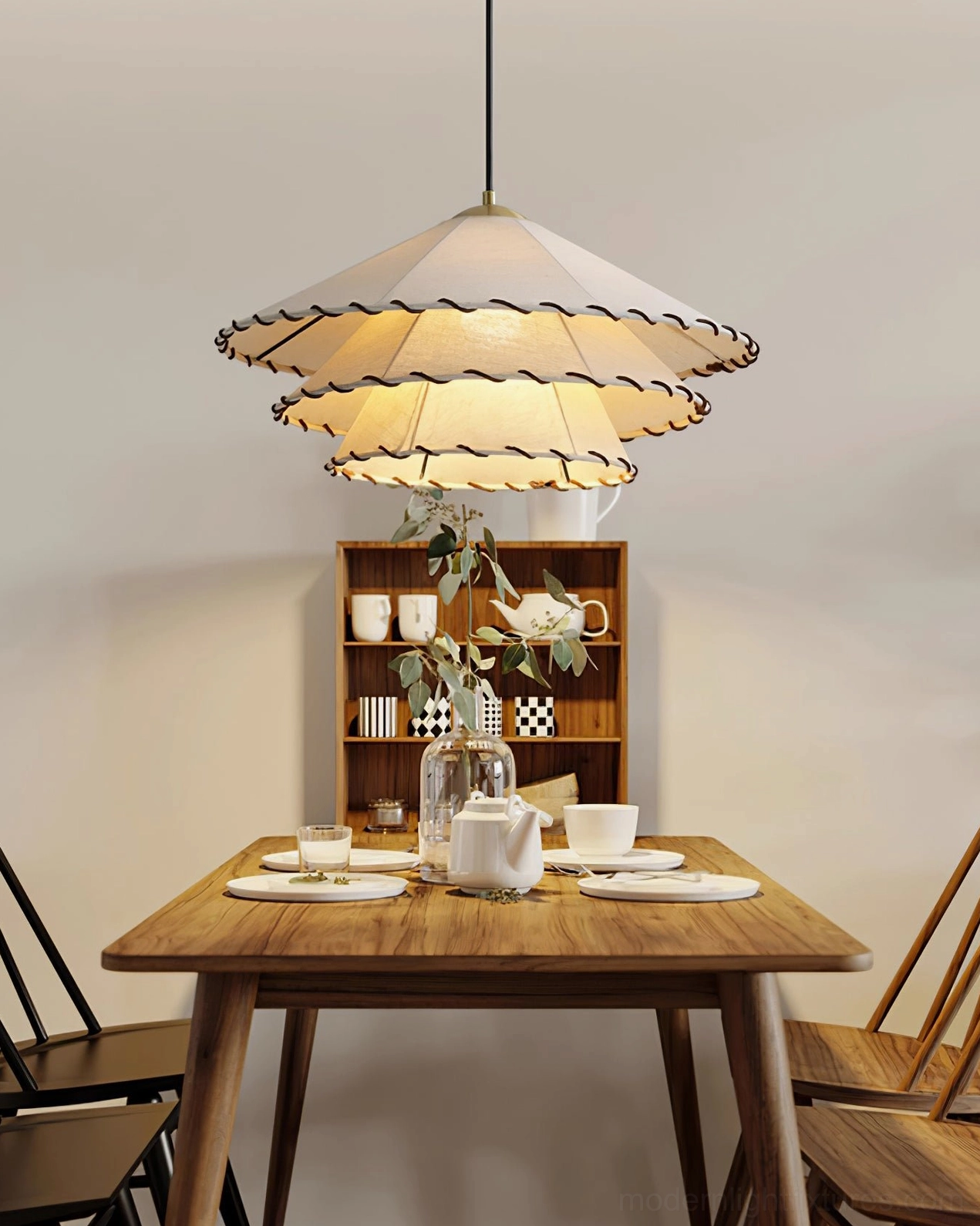 Handcrafted ruffled fabric pendant lamp creating atmospheric glow in modern minimalist dining environment
