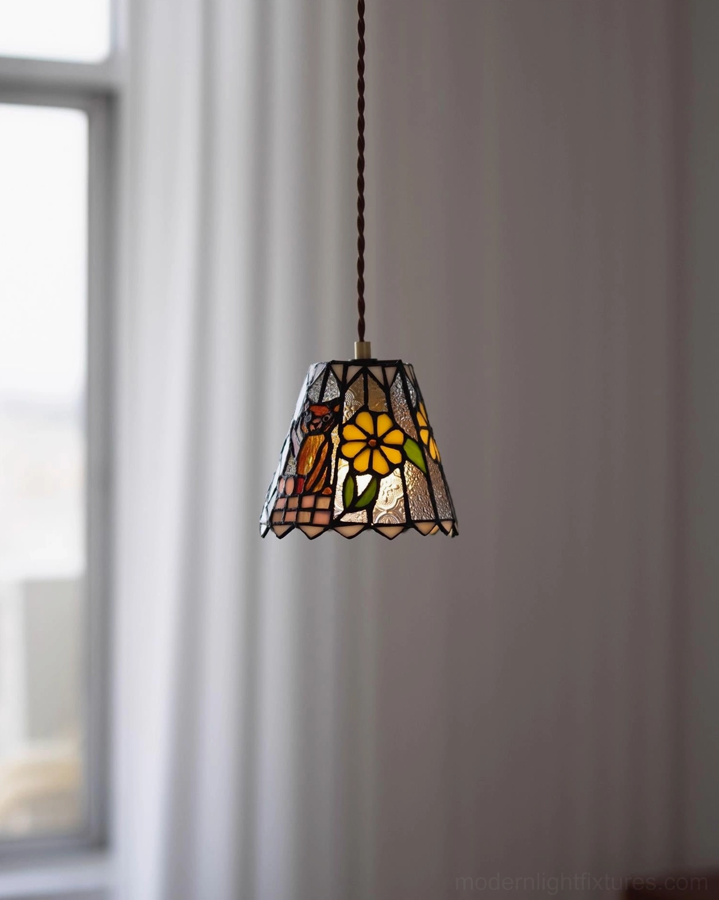 Handcrafted stained glass pendant lamp with diffused warm light and vintage Tiffany glass aesthetic