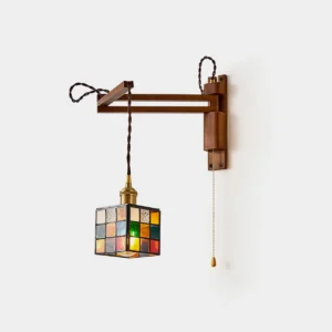 Handcrafted stained glass swing arm wall sconce with walnut wood frame and geometric grid shade in studio lighting, front view product photography