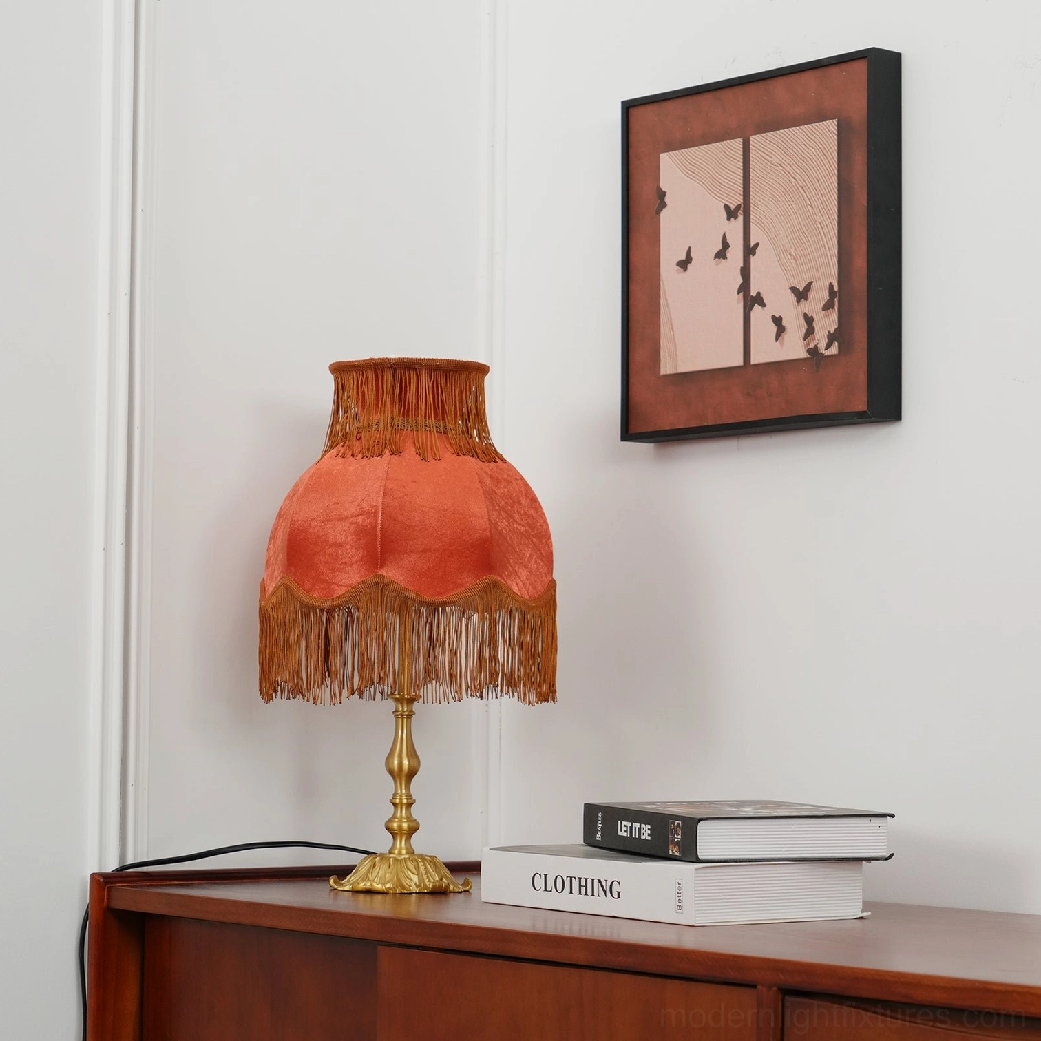 Handcrafted tassel table lamp with warm brass finish and luxurious fringe shade