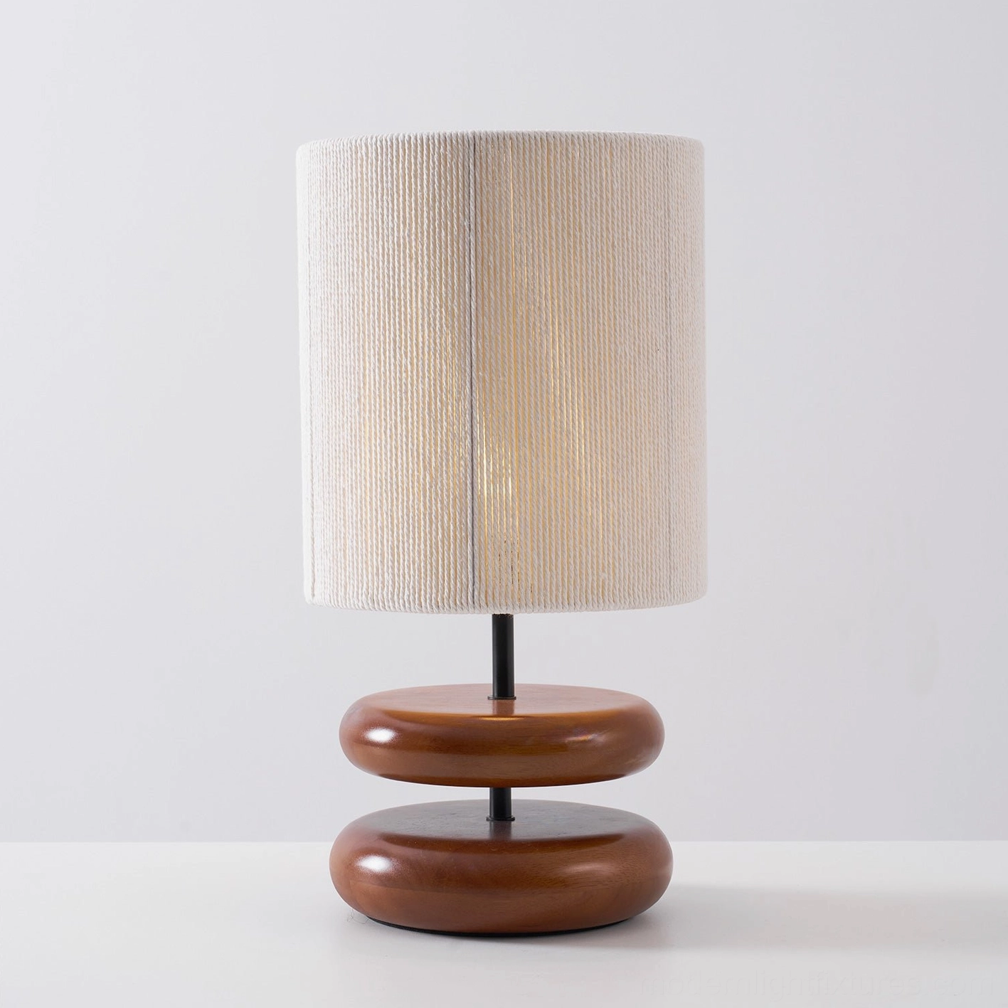 Wooden lamp with handcrafted base creating warm ambient light in home environment