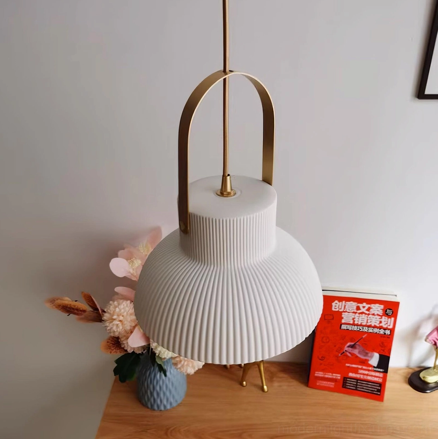 Handmade ceramic pendant lamp installation in modern eclectic home interior