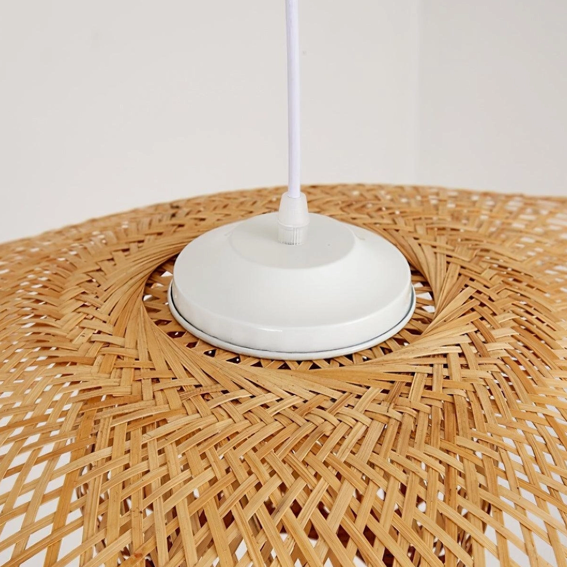 Handwoven bamboo lotus leaf pendant lamp detail showing traditional artisanal craftsmanship and organic texture