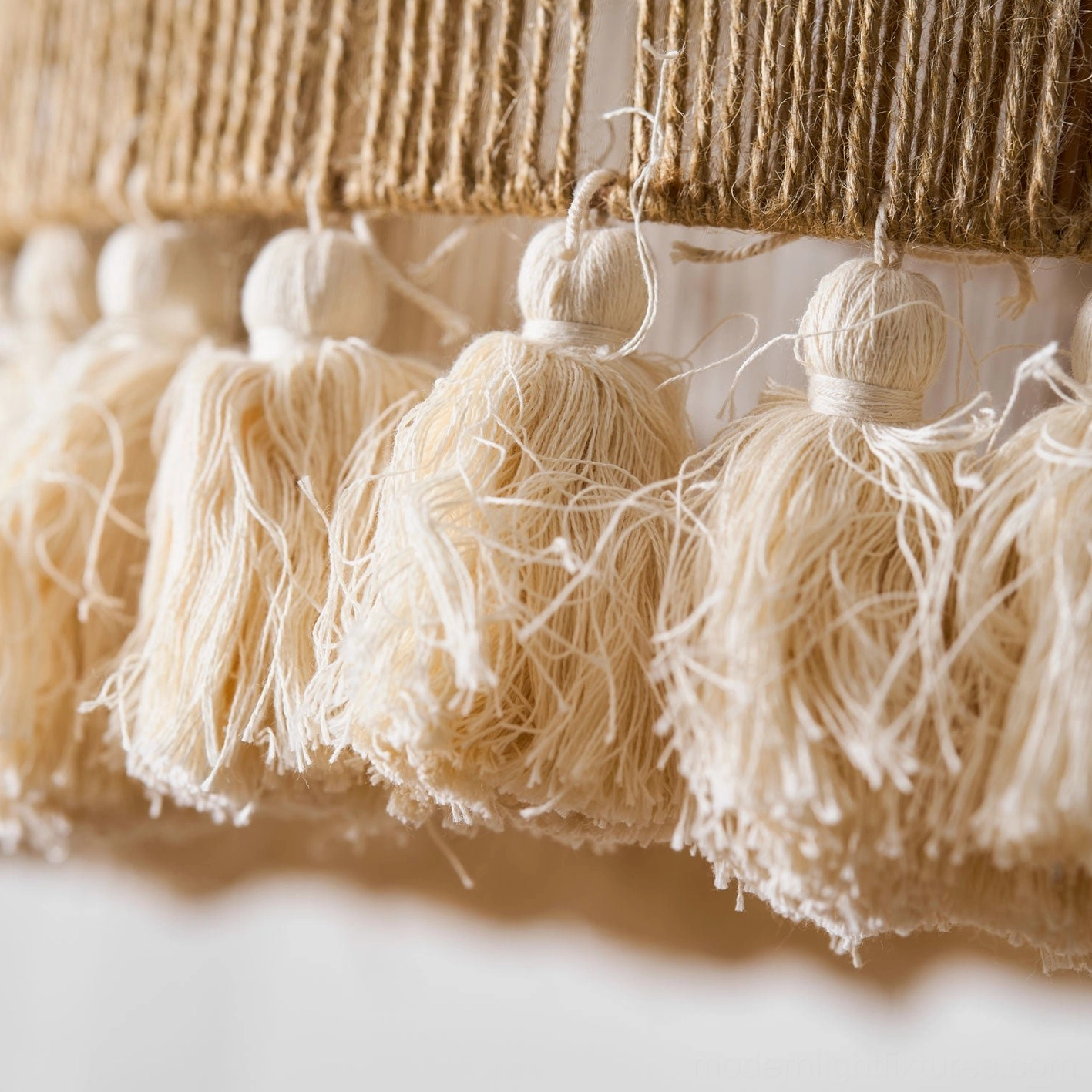 Handwoven bohemian tassel pendant light in natural daylight interior environment