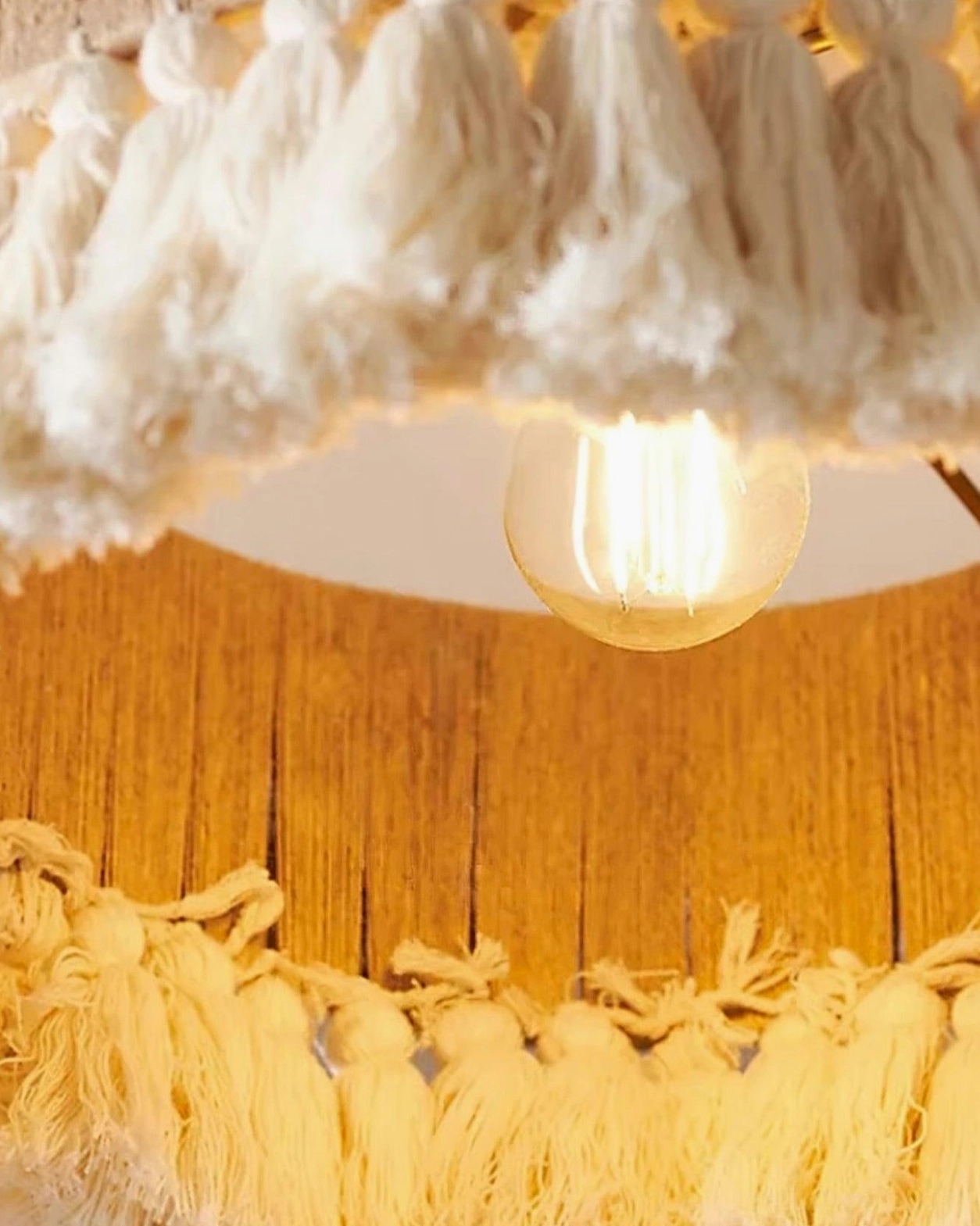 Handwoven boho tassel pendant lamp in eclectic bohemian interior design setting