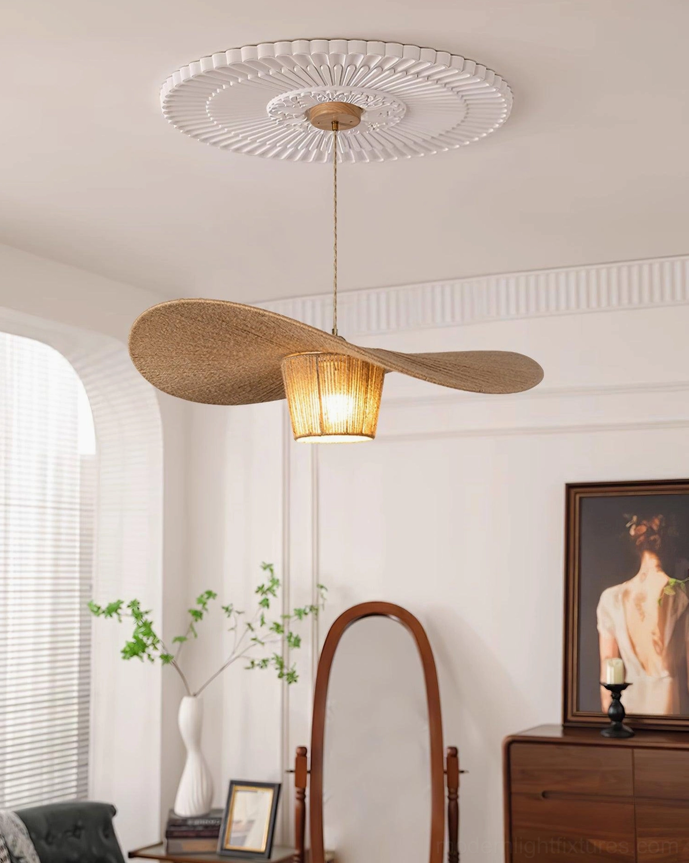Rustic pendant lamp with warm diffused light in elegant vintage room featuring ceiling medallion and retro interior design