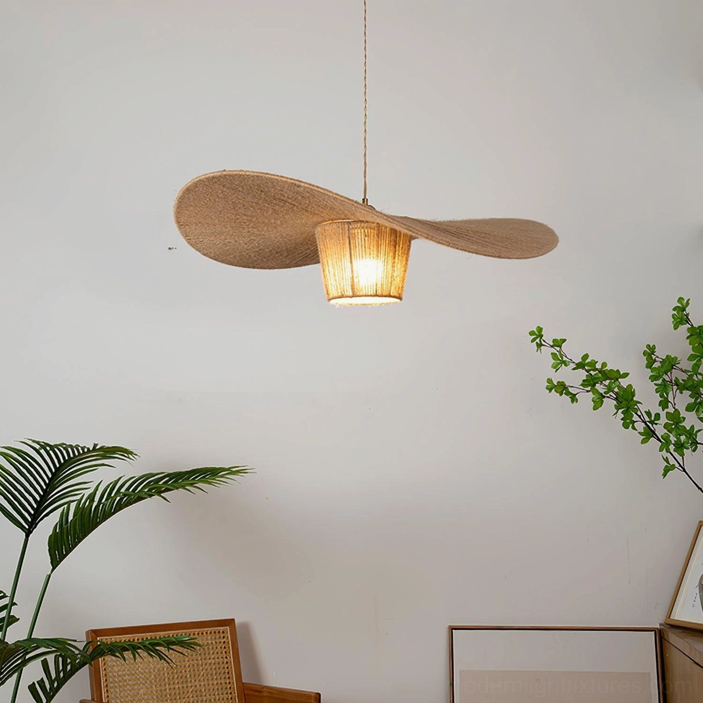 Artisan hemp rope pendant lamp suspended in wabi-sabi living space with green plants and natural rustic aesthetic