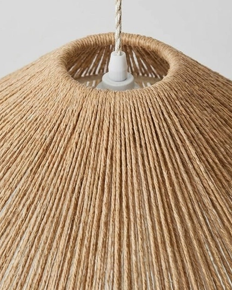 Handwoven jute-cord pendant light medium size suspended above kitchen island, organic modern kitchen design