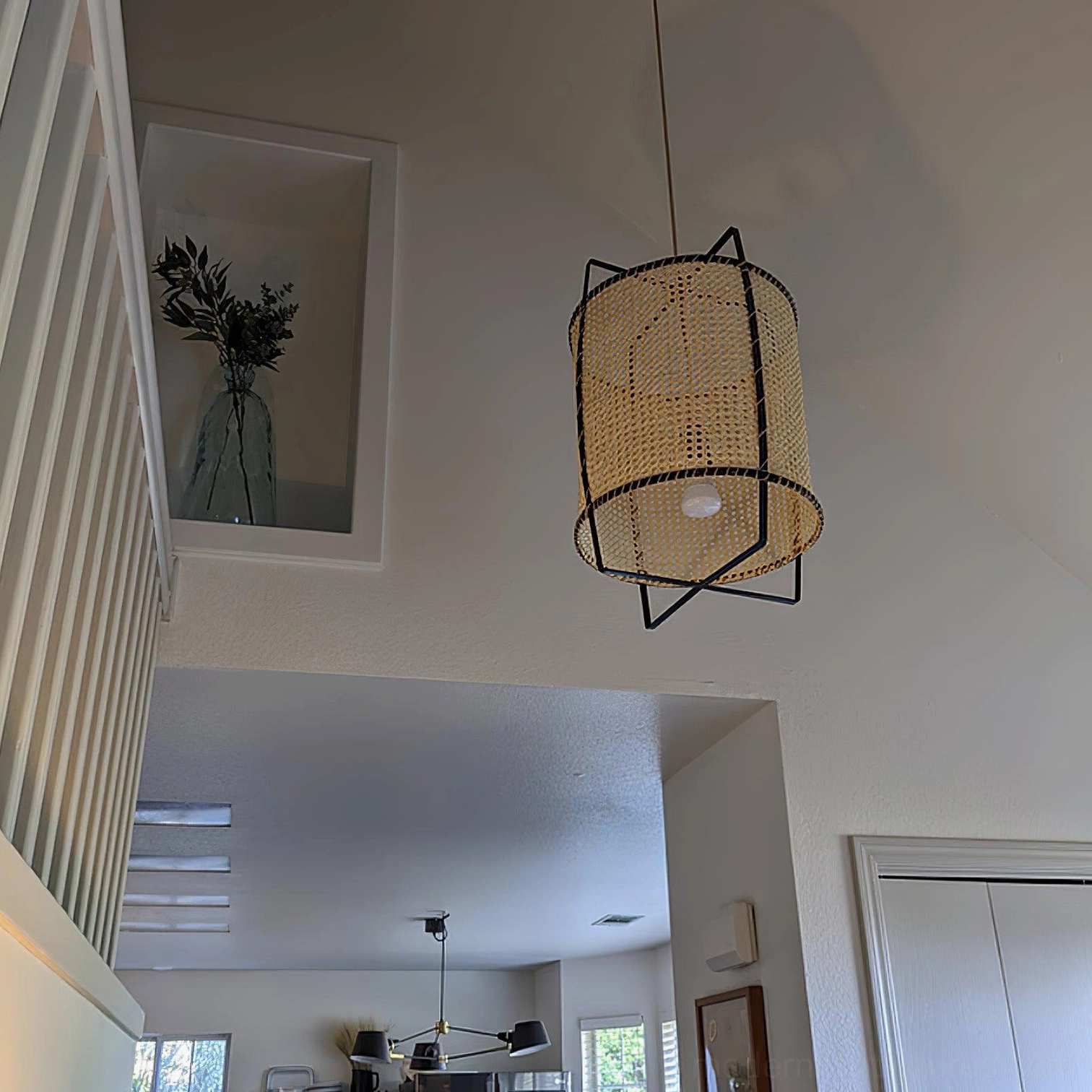 Handwoven rattan pendant lamp showing craft quality and natural material
