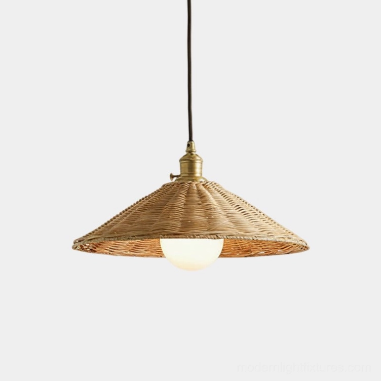 Studio shot of handwoven rattan pendant light with gold hardware and white globe bulb, bohemian style conical shade
