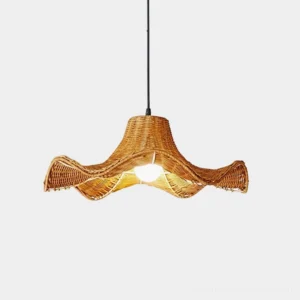 Straw pleat rattan pendant light with hand-woven pleated shade in warm natural rattan, studio front view