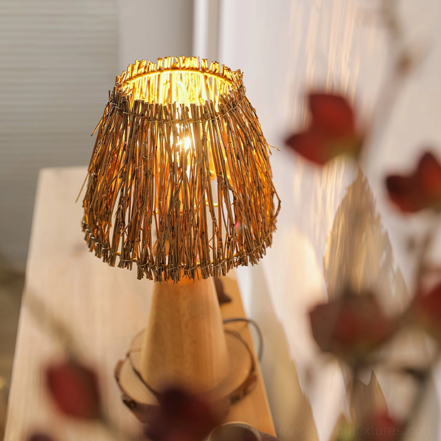 Close-up detail of handwoven straw lampshade with light wood stand, bohemian style