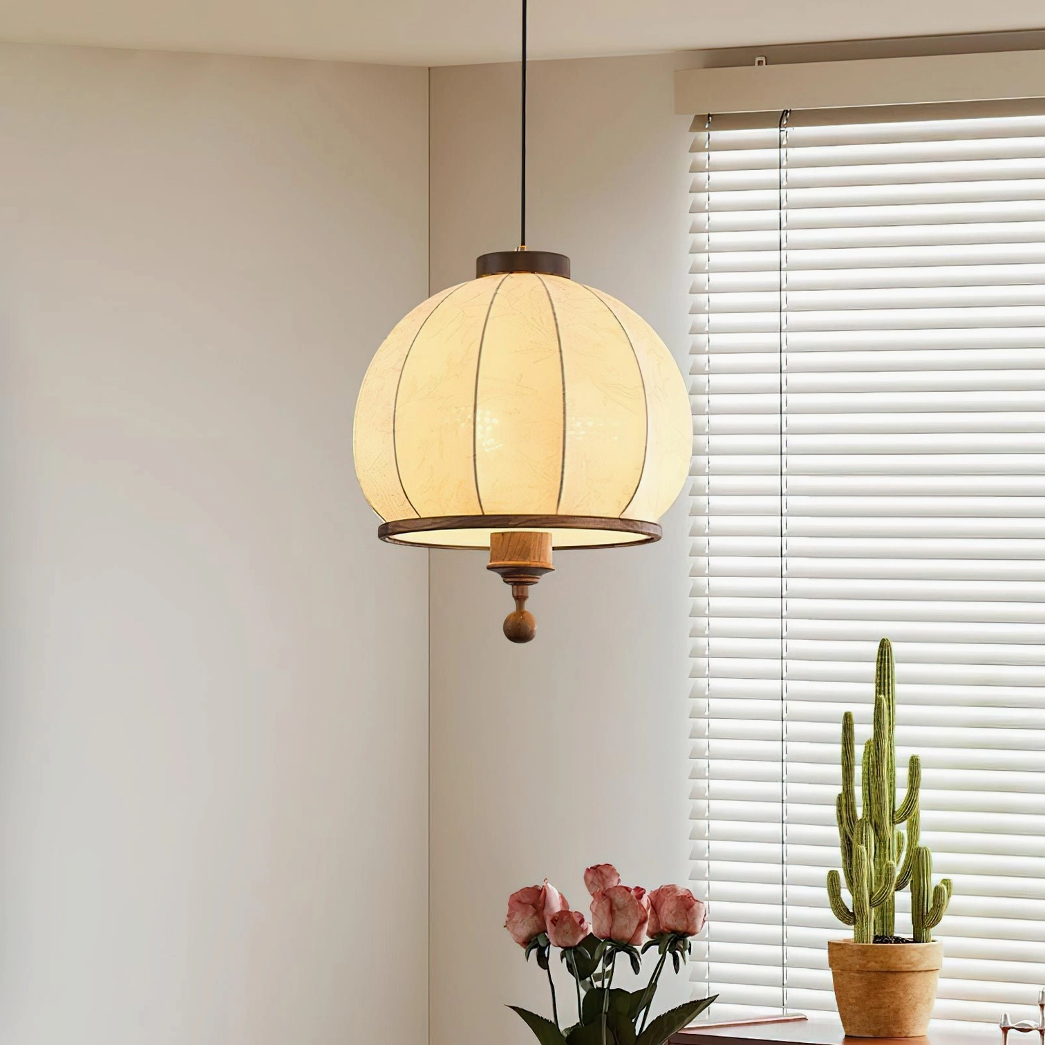 Harmony hanging pendant lamp with fabric shade and wood accents in minimalist home setting with window blinds