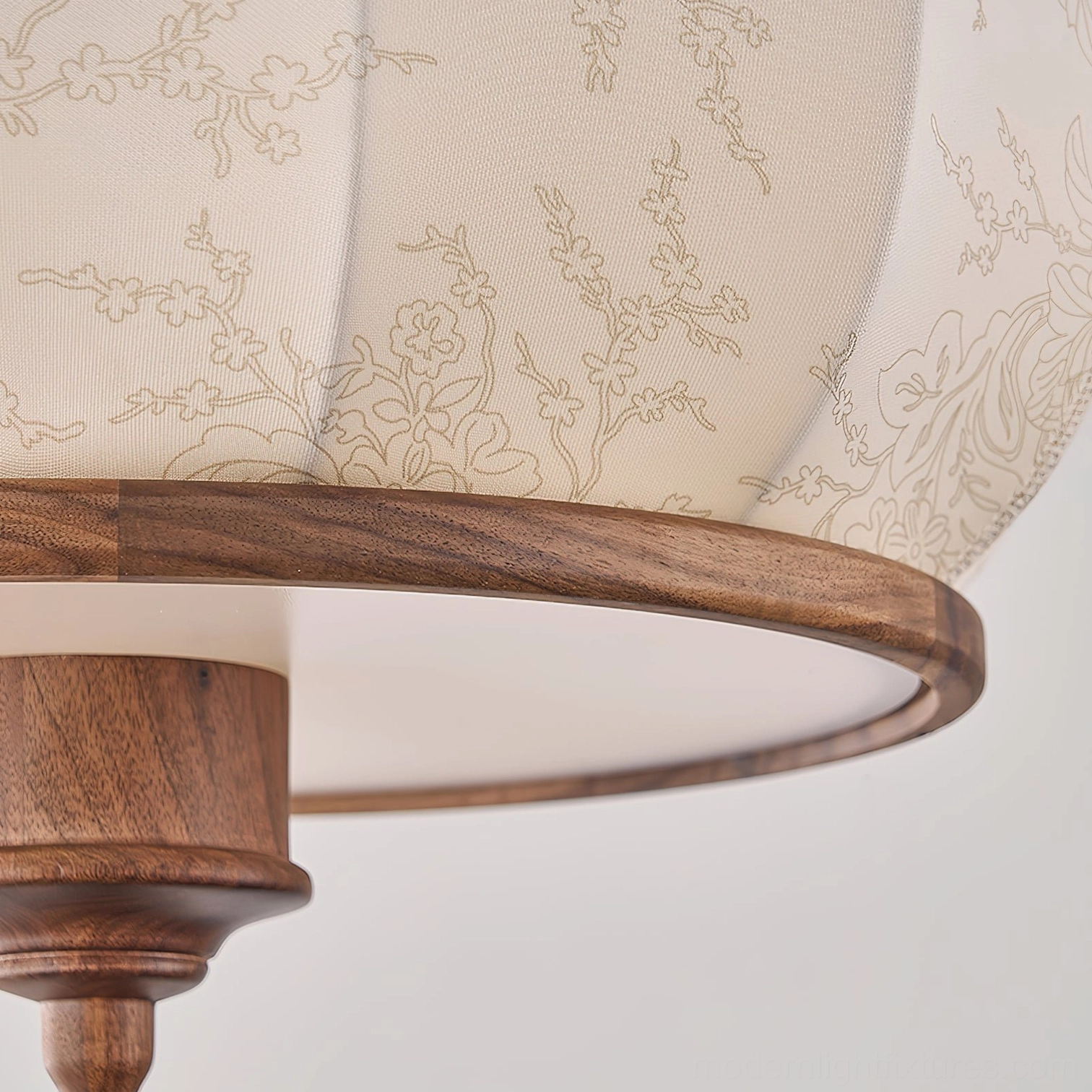 Hanging fabric pendant lamp with floral motif and wood frame in contemporary interior