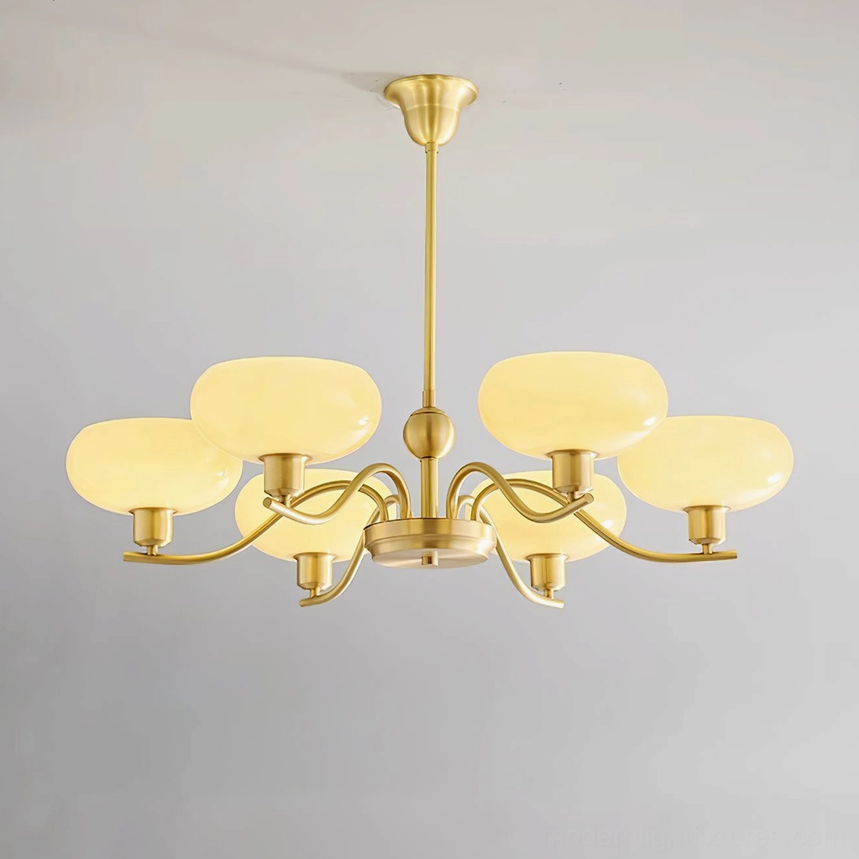 Havana 6-head mid-century modern chandelier with brass hardware and cream glass shades flat studio shot