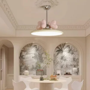 Heart pendant light hanging over French style dining table with pink heart accents