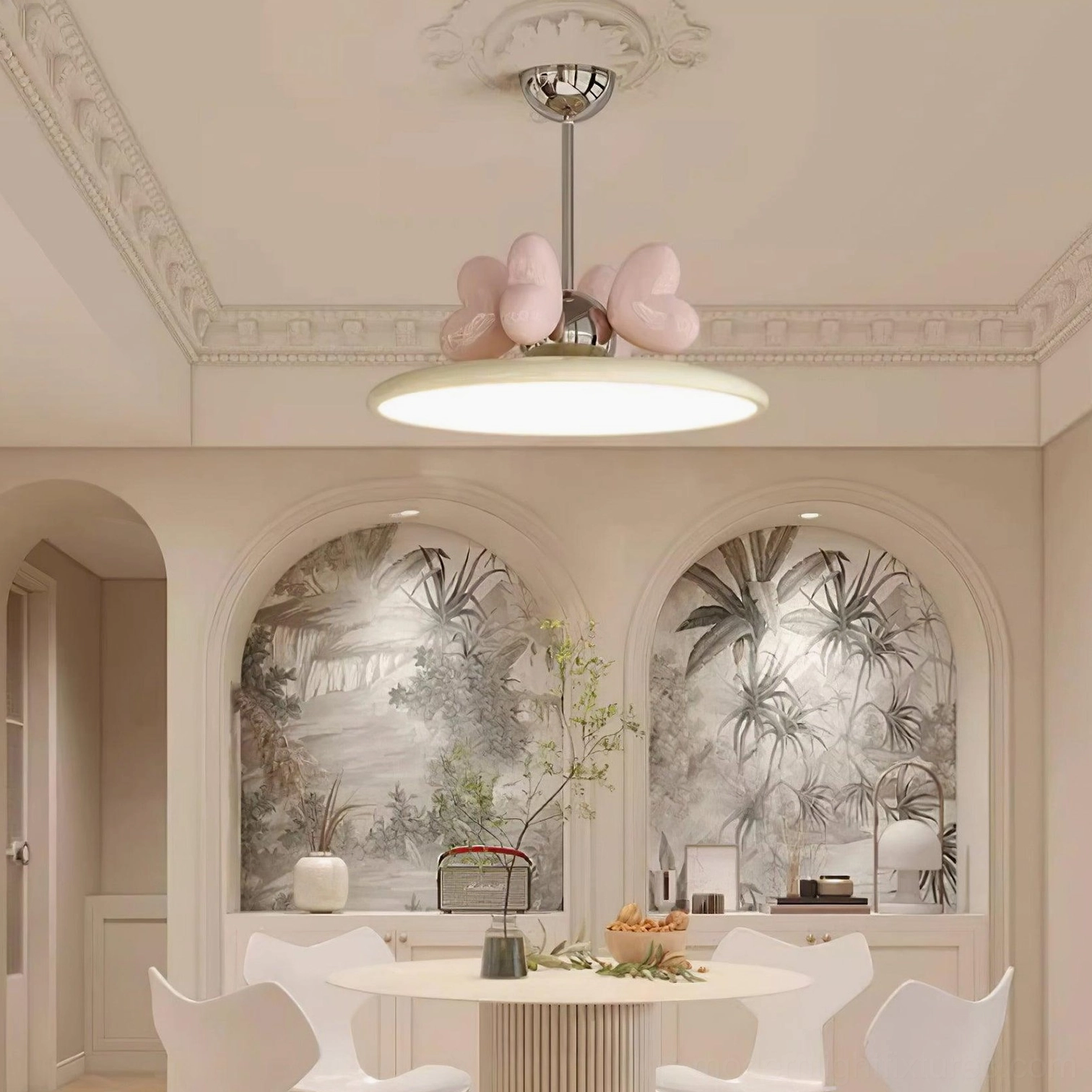 Heart pendant light hanging over French style dining table with pink heart accents