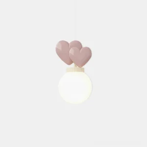 Heart-shaped pendant light with blush pink matte hearts and frosted white glass globe in studio close-up view