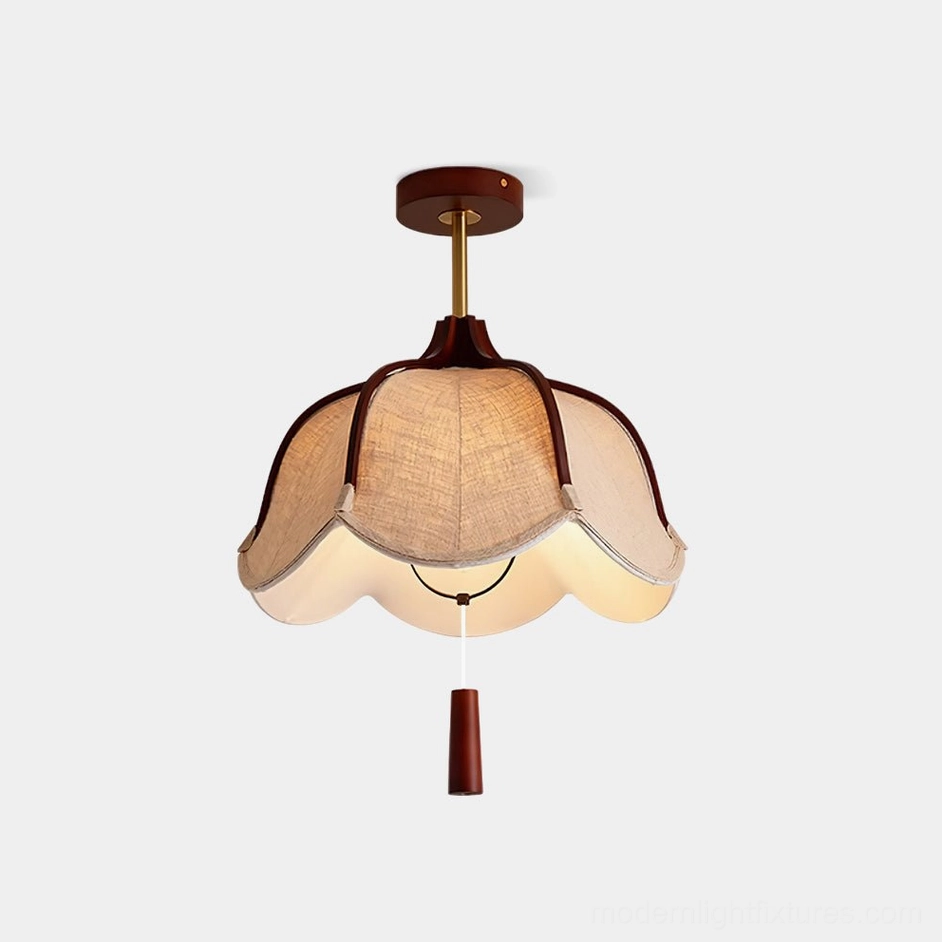 Helia petal fabric ceiling light fixture in studio view, showing delicate petal-shaped design with warm wood frame and linen shade