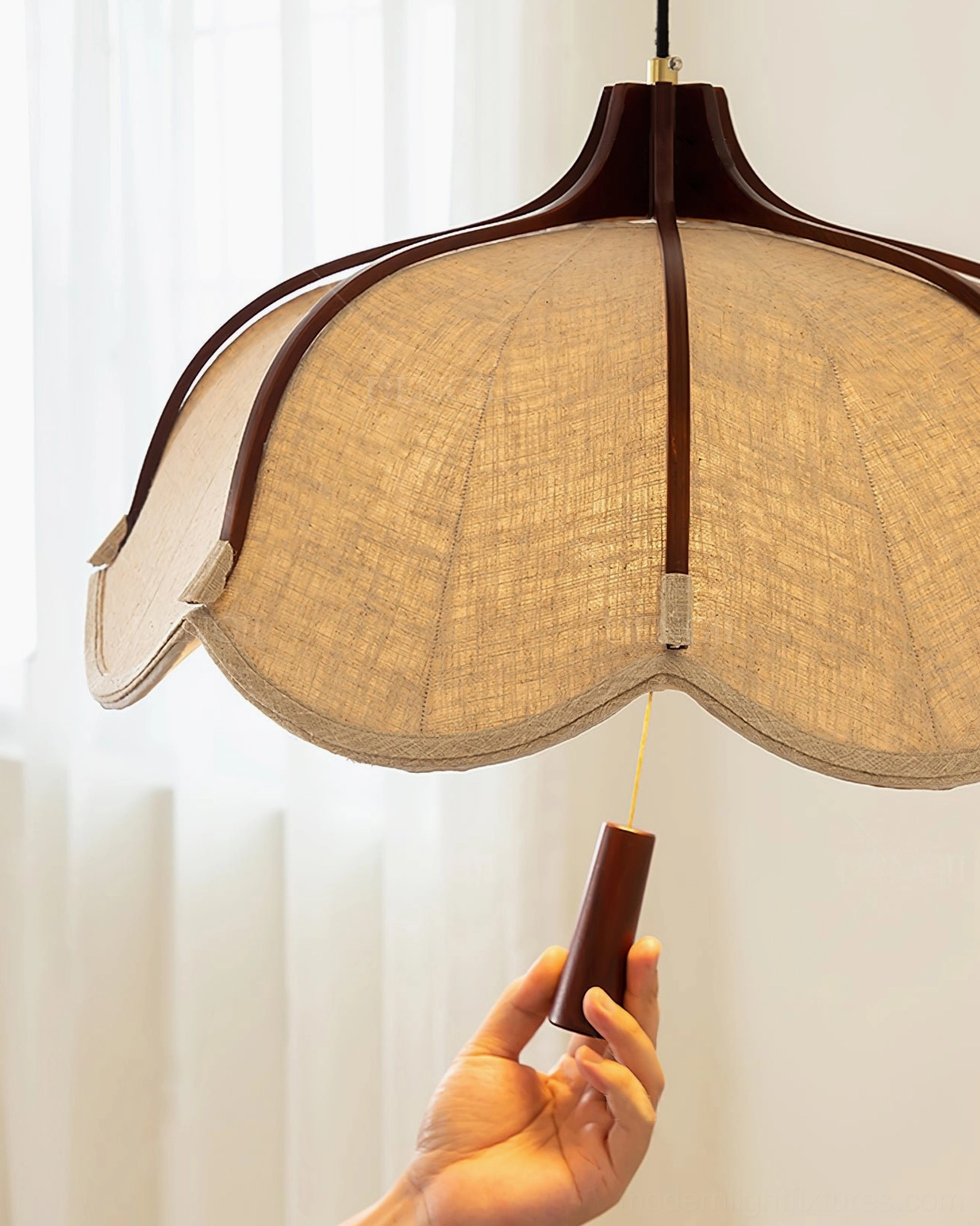 Helia modern pendant light showing walnut wood frame and beige fabric scalloped shade detail shot